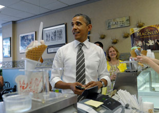 President Barack Obama gets ice cream at Deb's Ice Cream and Deli in Cedar Rapids, Iowa, Tuesday